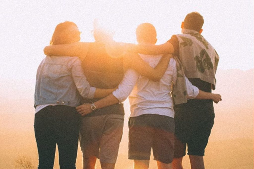 Team of volunteers stacking hands